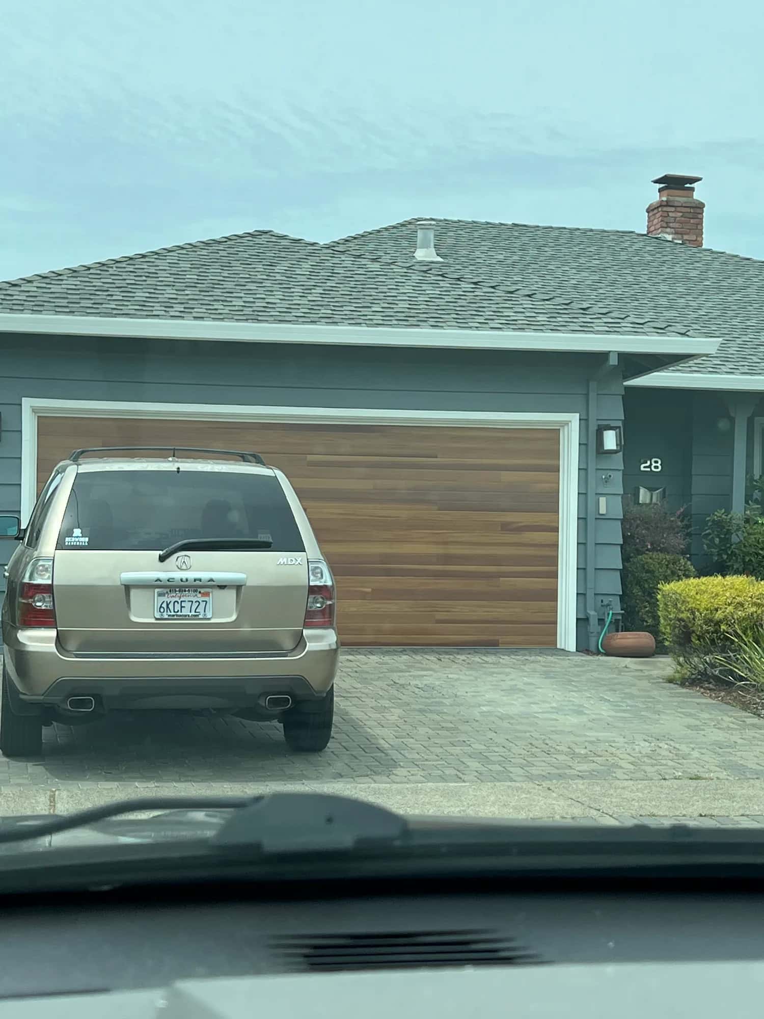 Wood garage door on a home, the kind we service in Soquel