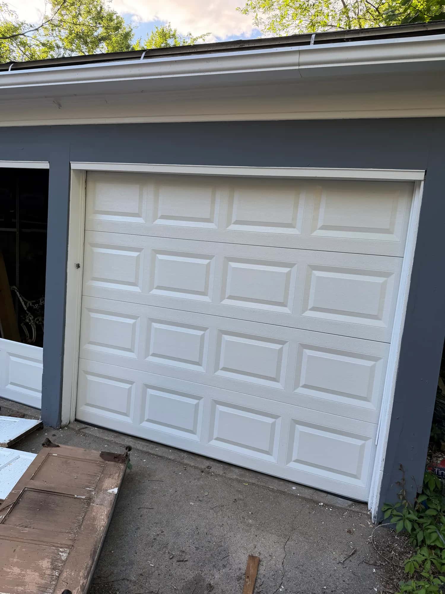 Newly installed white panel garage door