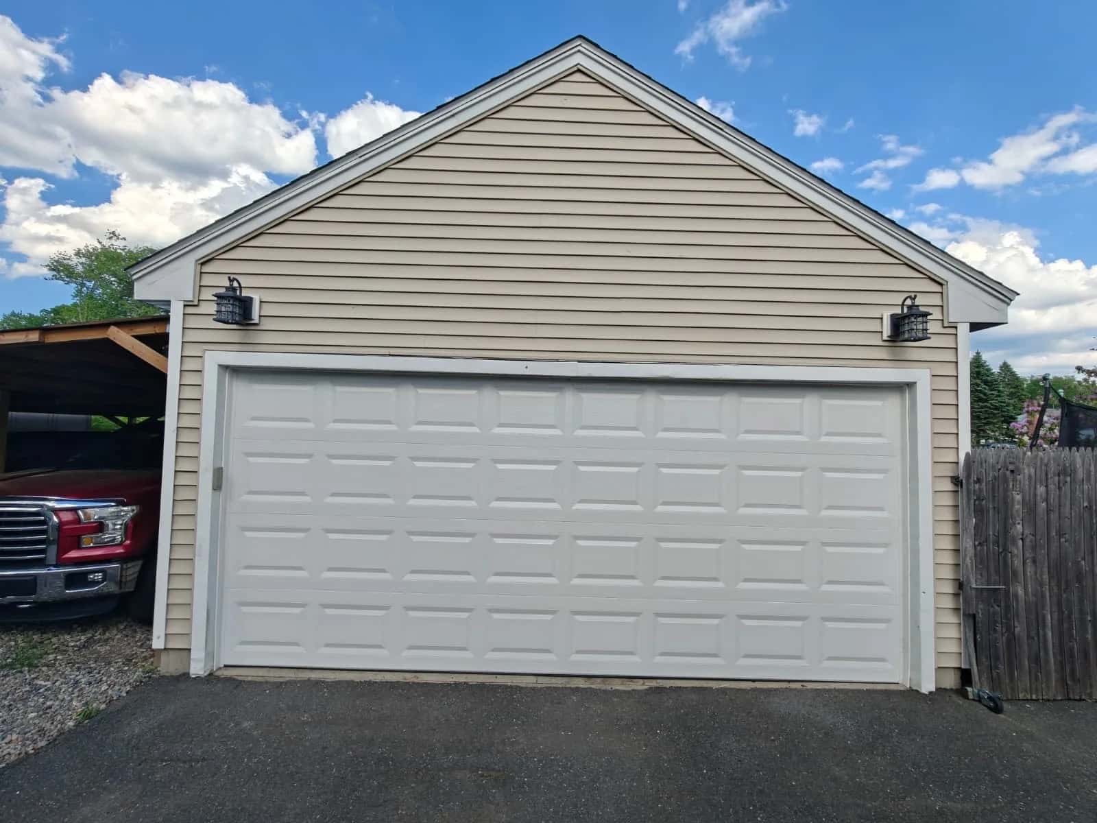 White sectional garage door on a house exterior