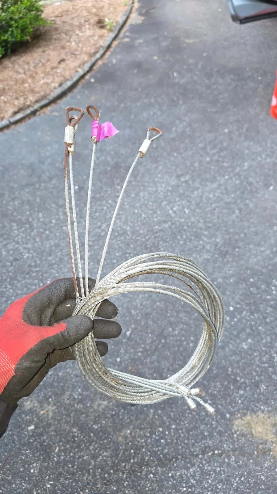 Garage door lift cables wound on a torsion drum