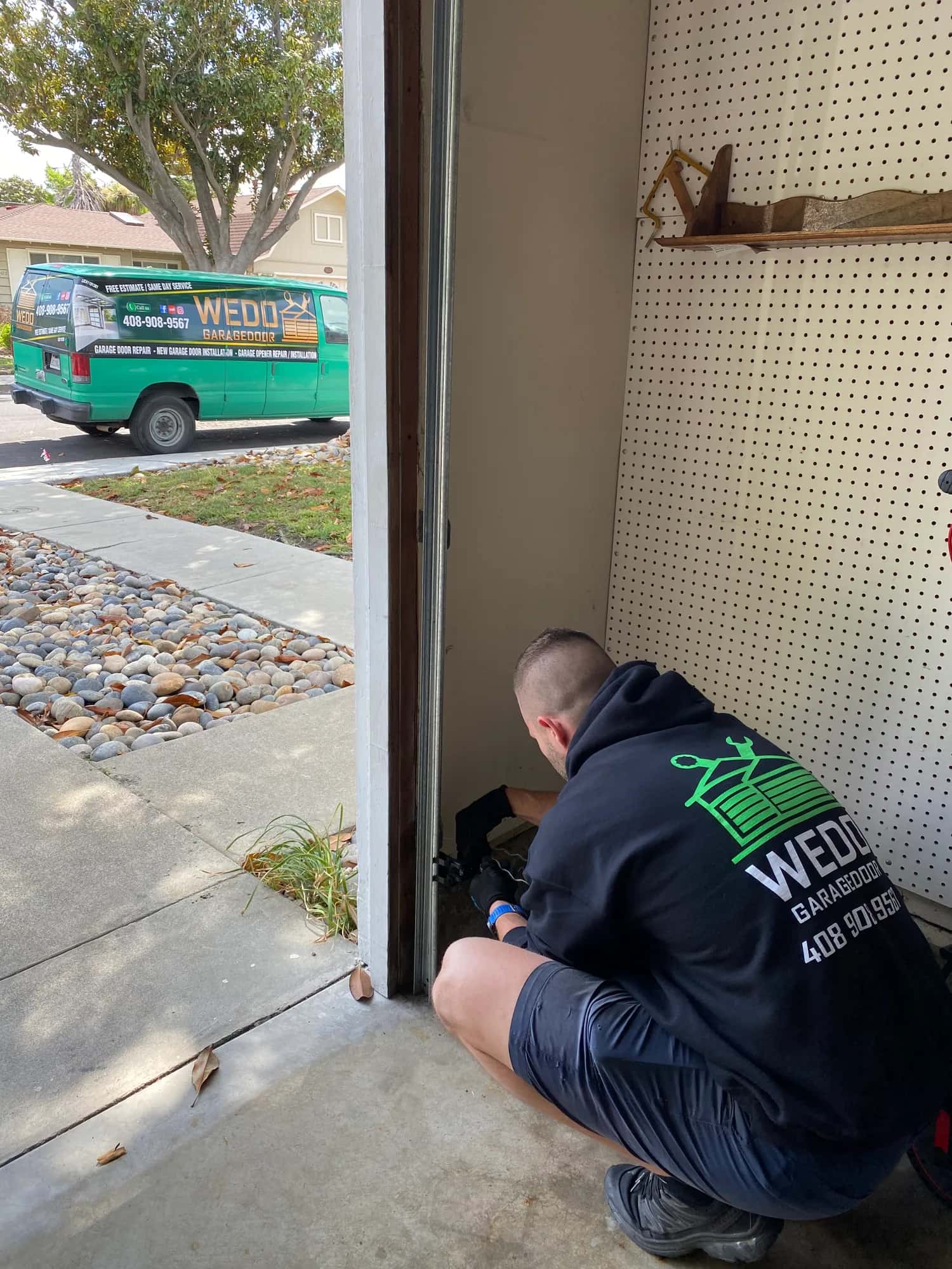 WeDo technician completing a residential garage door repair