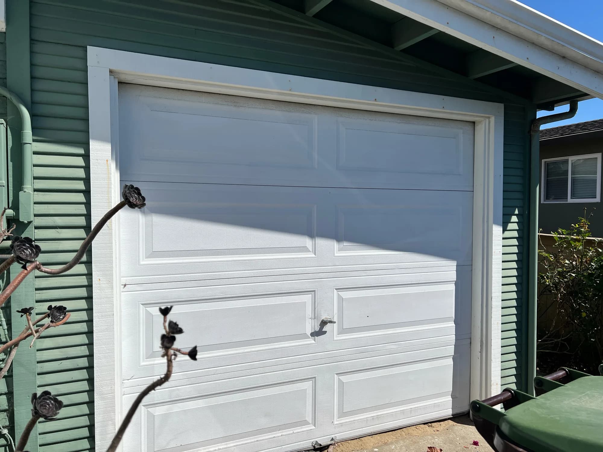 White residential sectional garage door