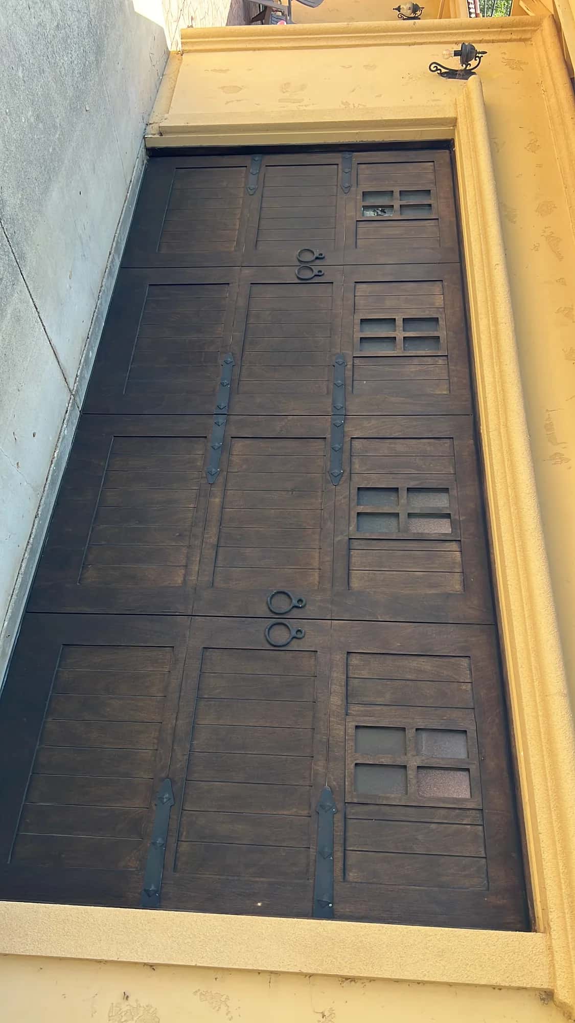 Rustic wood garage door with windows, common in Ben Lomond